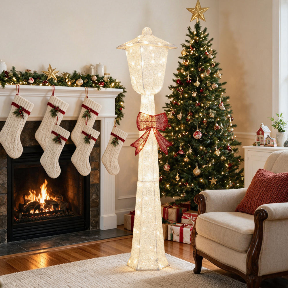 5 FT lighted Christmas lamp post with red bowknot decoration, featuring warm white LED lights for festive charm indoors or outdoors.