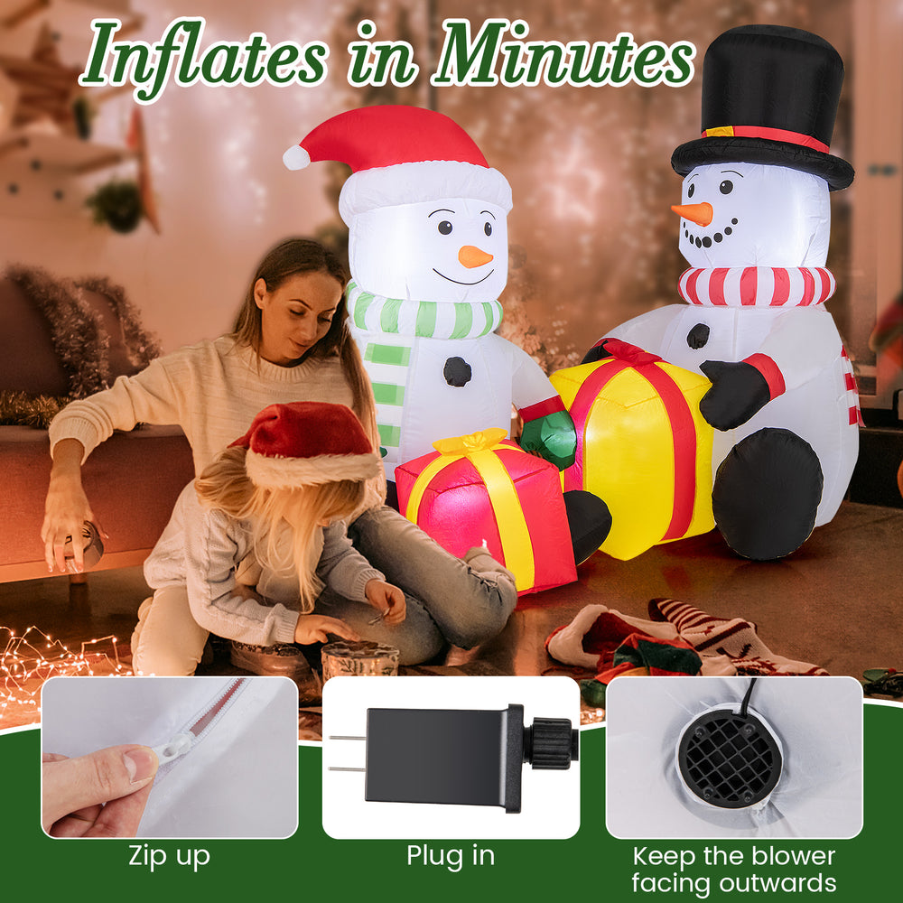Cute 5-foot inflatable snowmen with gift boxes, pre-lit, made of durable polyester for indoor and outdoor holiday cheer.