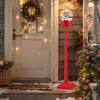 5 ft red musical Christmas street lamp snow globe lantern with Santa and snowman scene, perfect for festive outdoor.