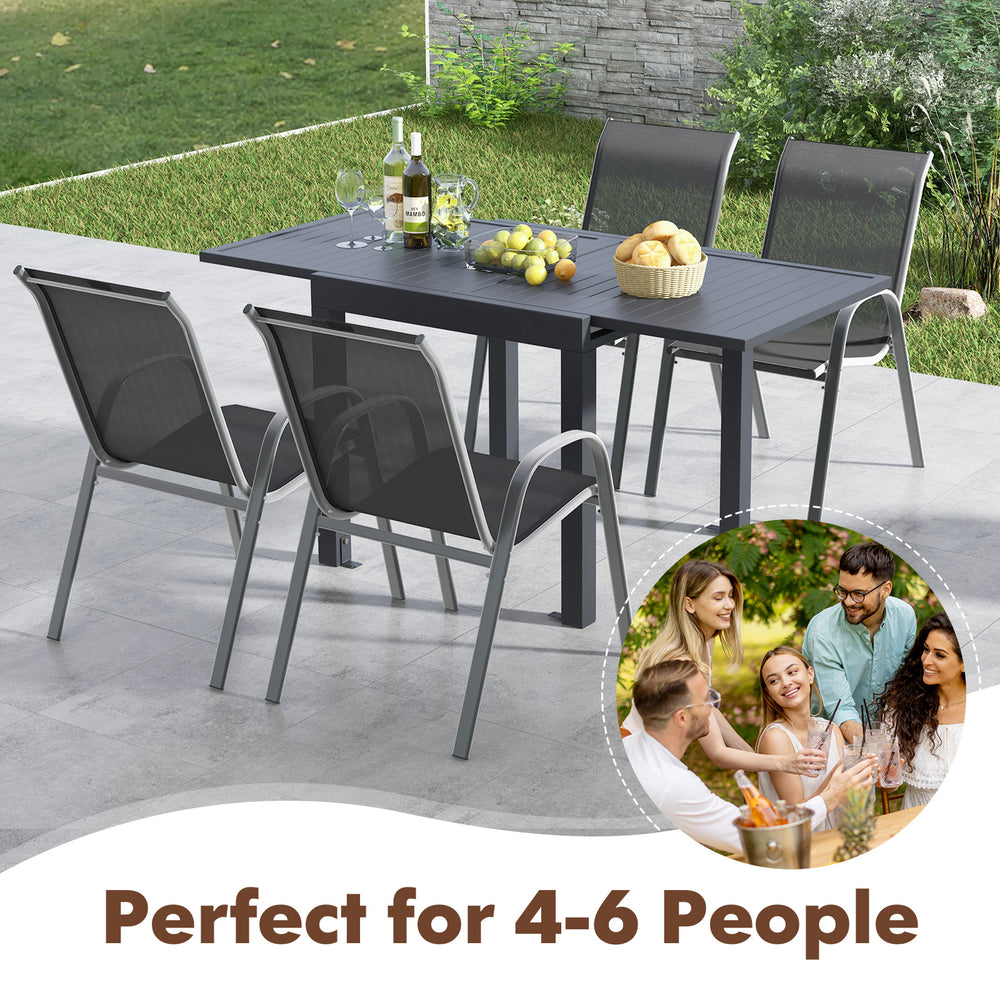Outdoor dining table set with extendable aluminum table and 4 stackable chairs, perfect for 4-6 people in any outdoor.