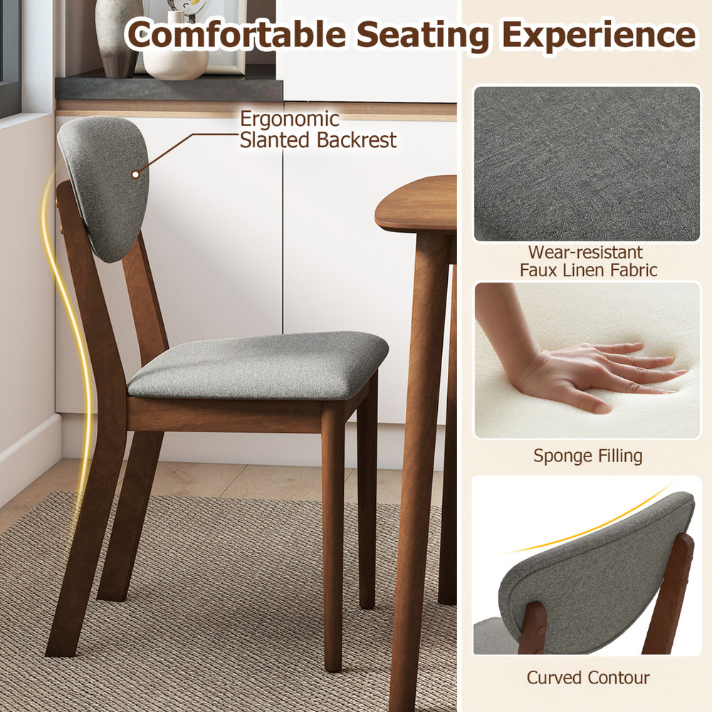 Gray dining chair with ergonomic slanted backrest and faux linen fabric, perfect for a comfortable dining experience.