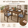 Rectangular dining table with four fabric chairs in gray, accommodating up to 4 people for dining or coffee breaks.