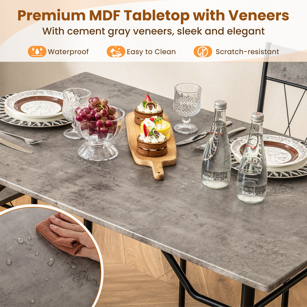 Dining table set with cement gray MDF tabletop and four chairs, showcasing a sleek design for elegant dining.