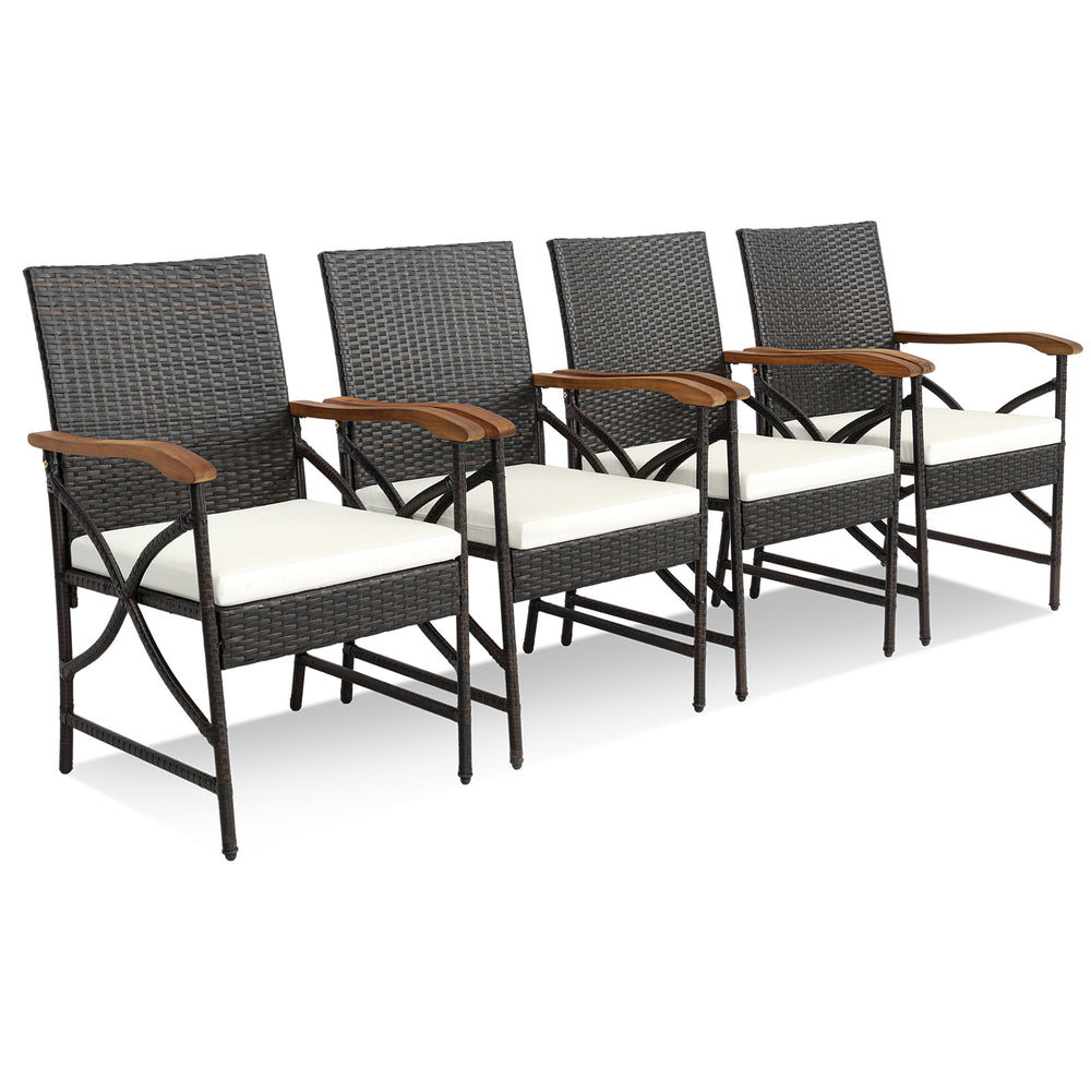 Four outdoor dining chairs made of hand-woven PE rattan with soft cushions, featuring ergonomic armrests for comfort.