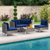 5-piece outdoor furniture set featuring navy cushions, PE rattan chairs, and a tempered glass coffee table by the pool.