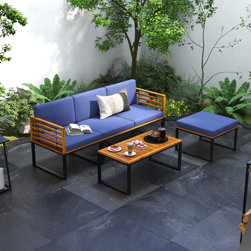 5-piece patio set featuring navy cushions, acacia wood frame, and coffee table, perfect for outdoor relaxation.
