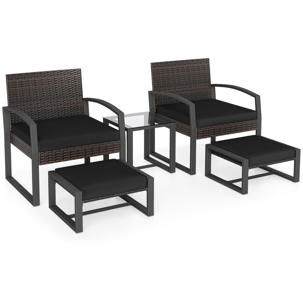 5-piece patio conversation set featuring 2 black cushioned chairs, 2 ottomans, and a tempered glass side table.