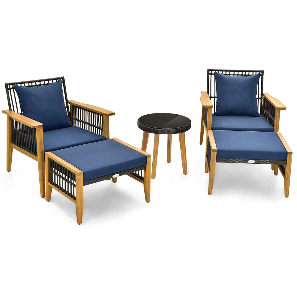Two navy lounge chairs with ottomans and a coffee table, featuring acacia wood and PE rattan for outdoor relaxation.