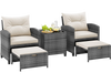 Two gray rattan chairs with cream cushions, two ottomans, and a tempered glass coffee table for outdoor relaxation.
