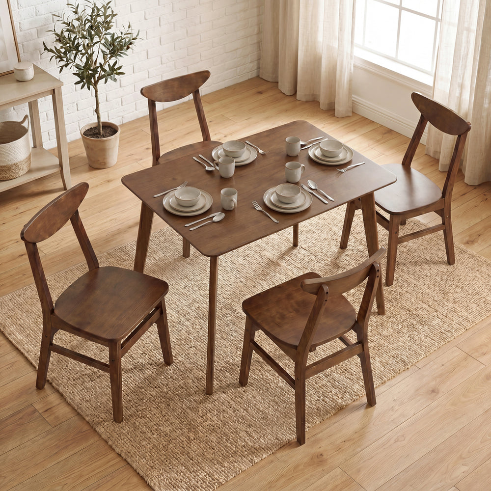 5-piece solid wood dining table set in walnut finish, perfect for small spaces, arranged with tableware.