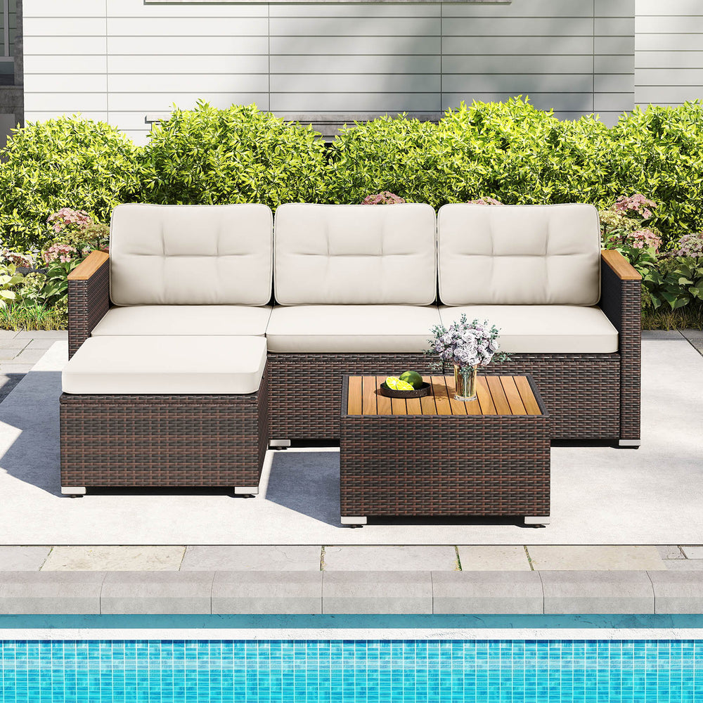 5-piece wicker conversation set with white cushions and acacia wood tabletop, ideal for outdoor patio relaxation.