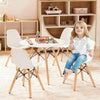Single white chair from the kids mid-century modern table and chairs set with wood legs, designed for comfort and.