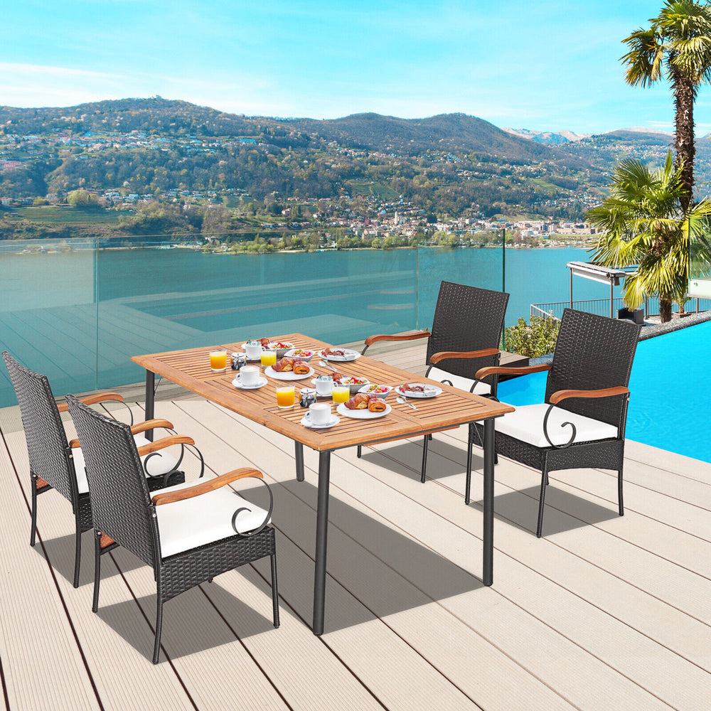 5-piece patio wicker dining set featuring acacia wood table and hand-woven PE rattan chairs with detachable cushions.