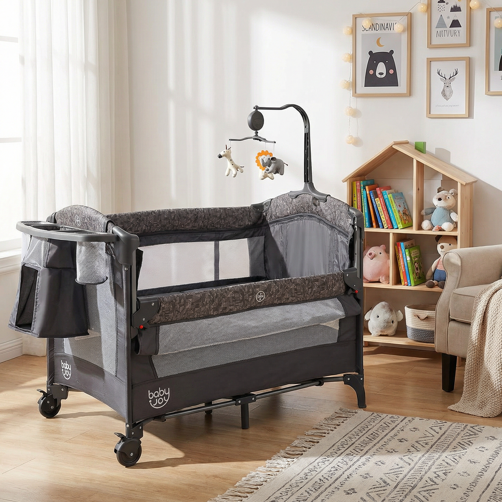 5-in-1 bedside bassinet in gray with detachable changing table, mesh panels, and wheels for easy mobility and safety.