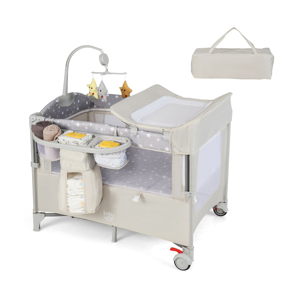 Portable 5-in-1 baby beside sleeper bassinet in beige with diaper changer, storage pockets, and mobile for travel use.