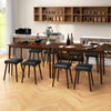 Compact upholstered stool with padded PU leather seat and rubber wood legs, designed for easy storage under the table.