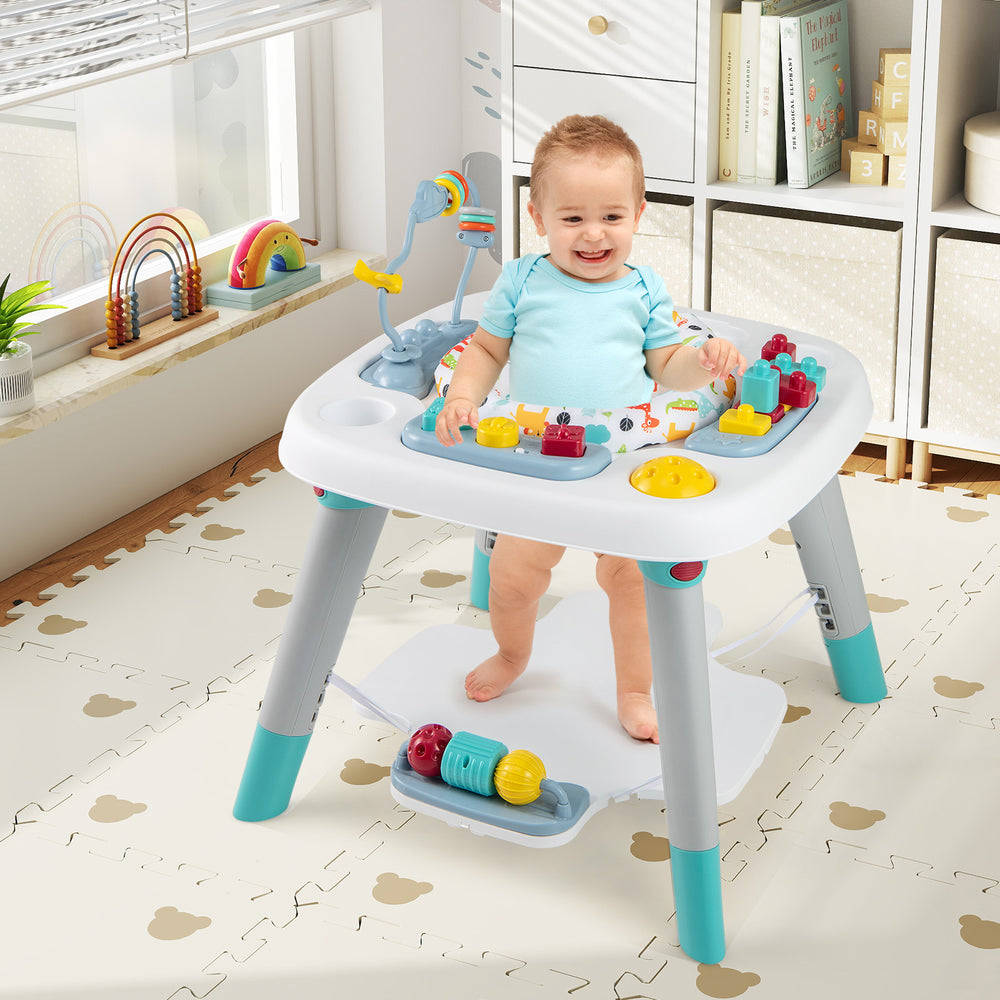 Toddler standing at the 6-in-1 Baby Activity Center, exploring various interactive toys and engaging features.