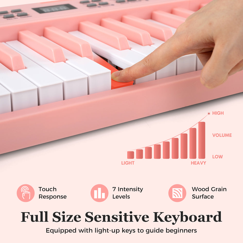 Full-size pink 61-key electronic keyboard with touch-sensitive keys and wood grain surface, ideal for beginners.