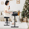 61-key portable electronic keyboard piano with stand and stool, perfect for practice and performance in a cozy setting.