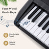 Faux wood grain keys on a black electric keyboard, designed for beginners with a comfortable touch and natural texture.