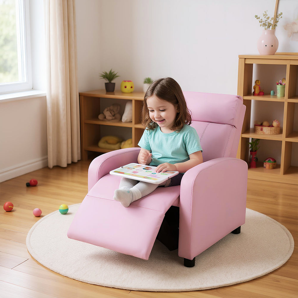 Kids pink PU leather recliner lounge sofa with adjustable backrest, perfect for reading and relaxing in playroom.