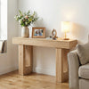 Console table with natural wood grain, 63" long, featuring sturdy legs and ample storage for entryway or living room.