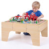 63 Piece Kids Train Table with Storage Drawer and Reversible Tabletop-Natural shown in use with toy tracks and accessories.