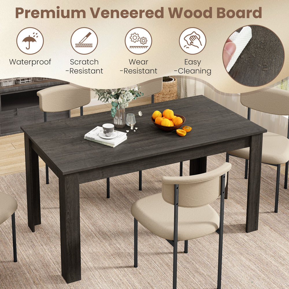 Rectangular 63-inch gray dining table with spacious surface, sturdy legs, and easy-clean finish for versatile use.
