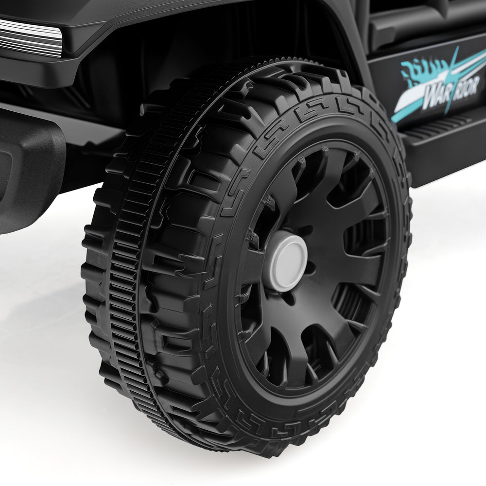 Close-up of the rugged black tire on the 12V kids ride-on truck, featuring a durable design for smooth outdoor.