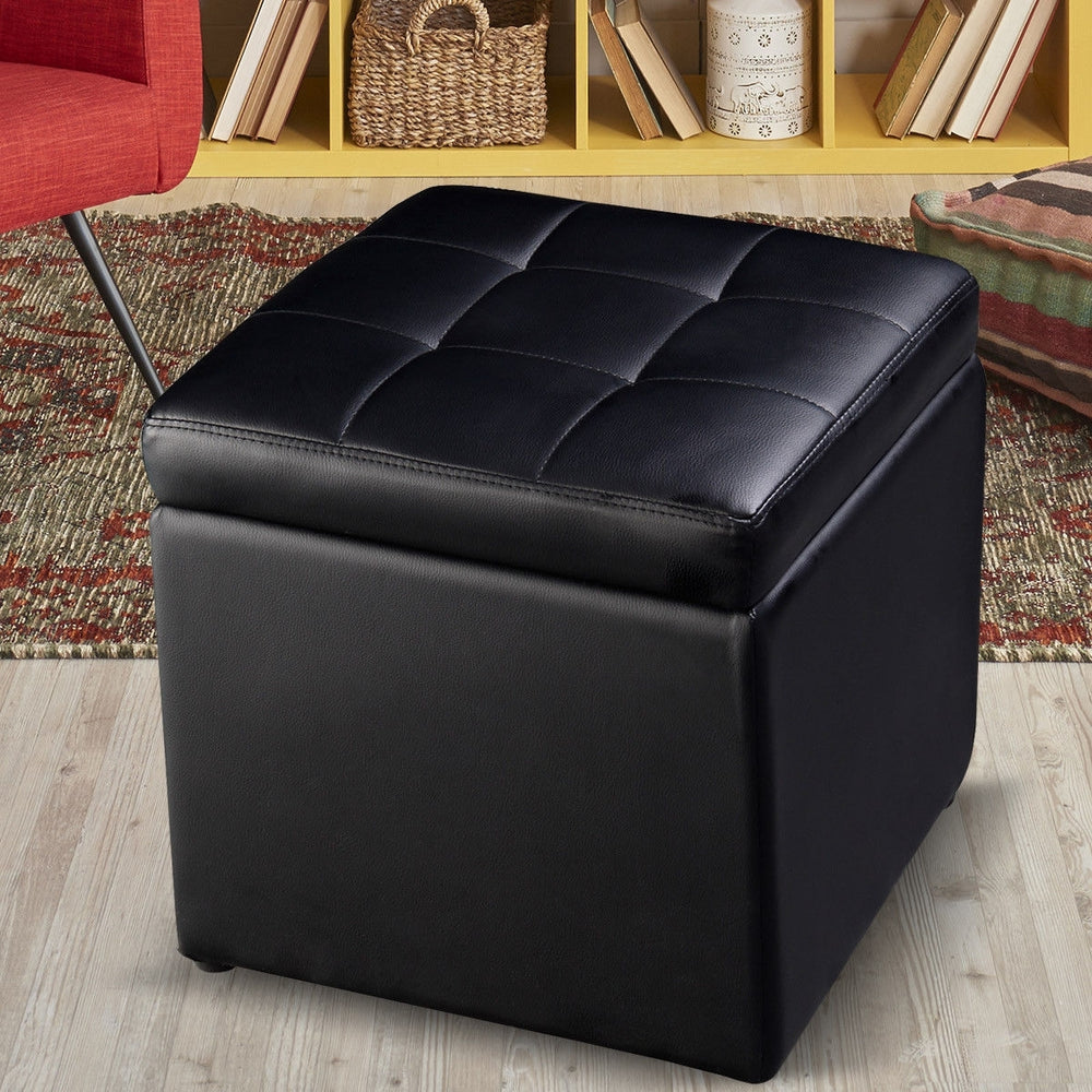 Black foldable cube ottoman pouffe with cushioned top for storage, ideal for organizing toys and accessories.
