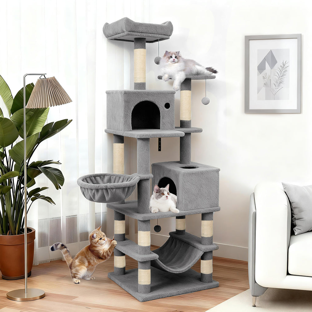 Multi-level 66-inch tall cat tree in light gray with two condos, sisal scratching posts, and plush perches for lounging.