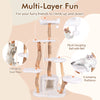 Multi-layer cat tree with solid wood trunks, plush platforms, and hanging sisal rope for climbing and play.