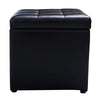 Black foldable cube ottoman pouffe with cushioned top, perfect for storage of toys and accessories.
