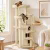 Three cats explore the 68-inch beige wooden cat tree with a cozy hammock and multi-level platforms for play and rest.