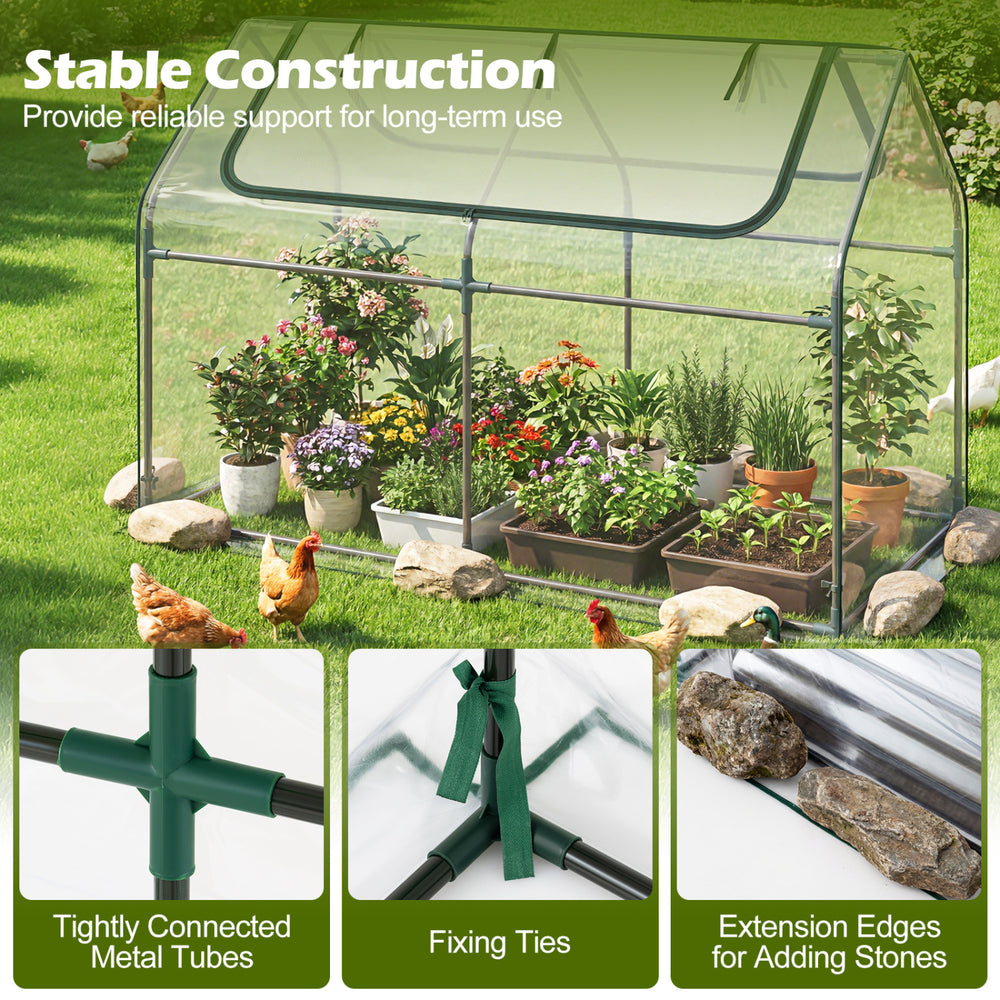 Mini greenhouse with raised garden bed, featuring a PVC cover and roll-up windows for easy access and air circulation.