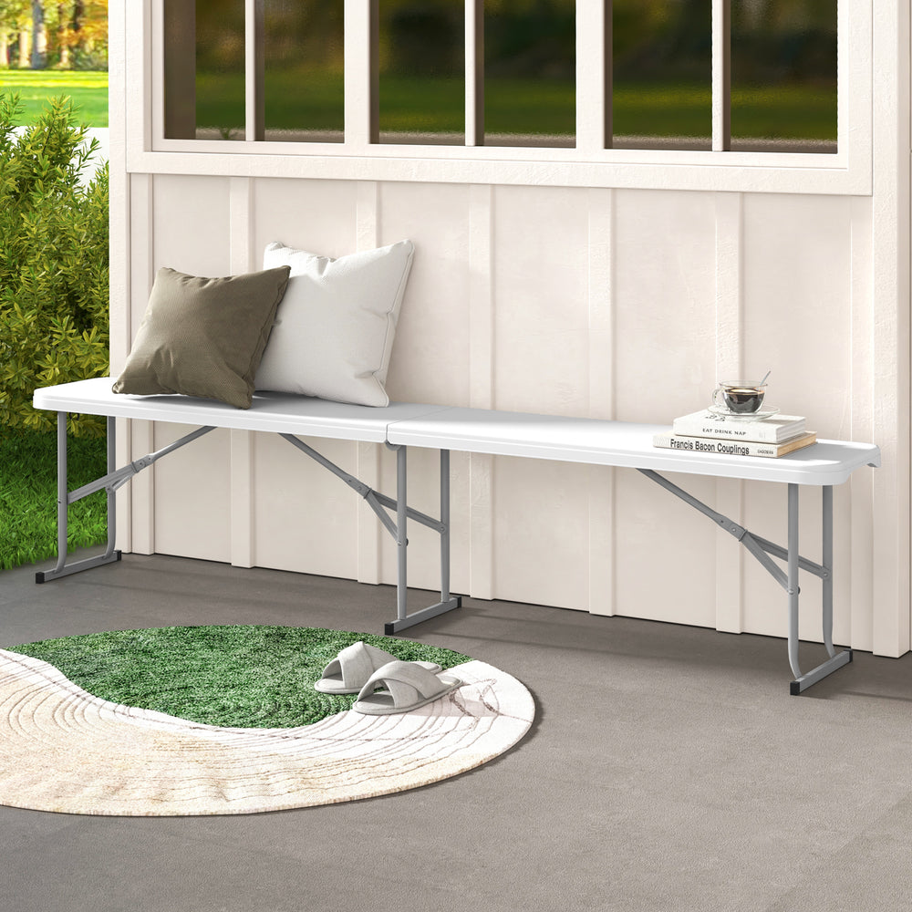 White 6-foot plastic folding bench with carrying handle, suitable for camping, dining, or outdoor seating.
