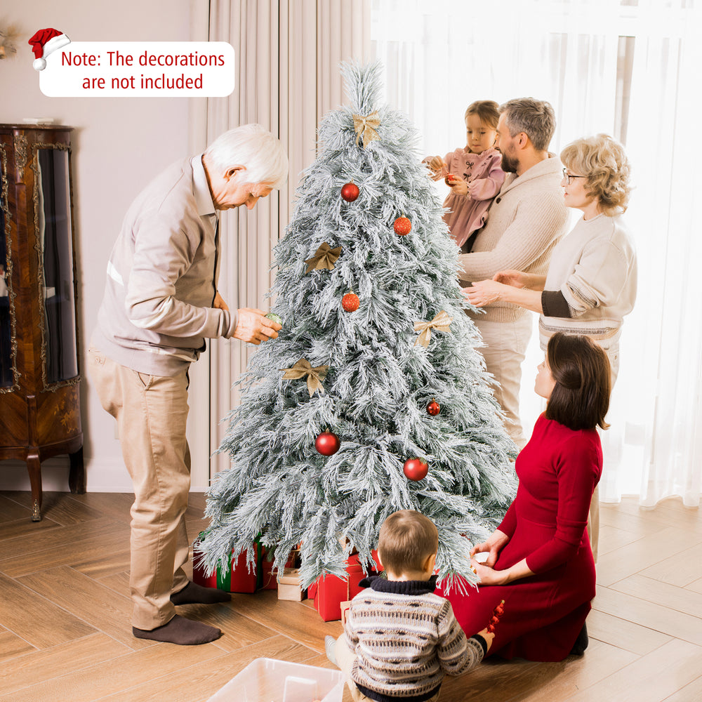 Snow-flocked 6 feet Christmas tree with warm white LED lights, ideal for festive home decoration.