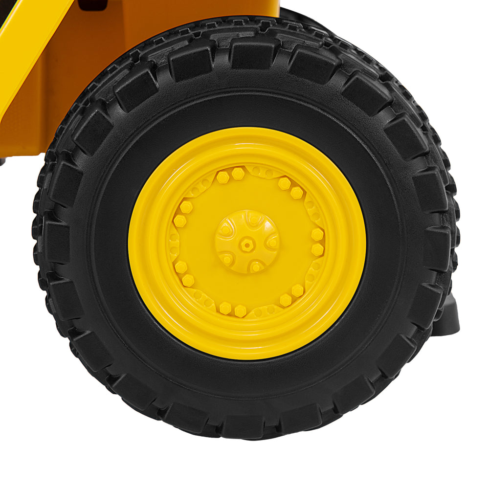 Close-up of the yellow tire on the 6V Electric Caterpillar Construction Vehicle, featuring treaded, anti-slip design.