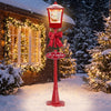Red 6.1 ft musical Christmas streetlight with LED lights, featuring a Santa scene and snowflakes for festive outdoor decor.