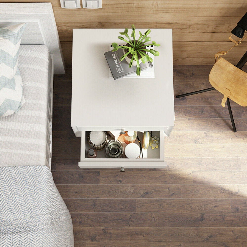 White wooden nightstand with two storage drawers, perfect for bedside decor and efficient space use in any room.