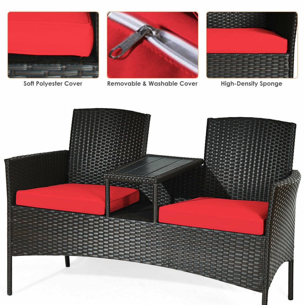 Modern patio conversation set featuring a built-in coffee table, red cushions, and durable rattan for outdoor comfort.