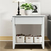 Narrow white 2-tier bedside table with drawer and lower shelf, made of P2 MDF and rubber wood, ideal for small spaces.