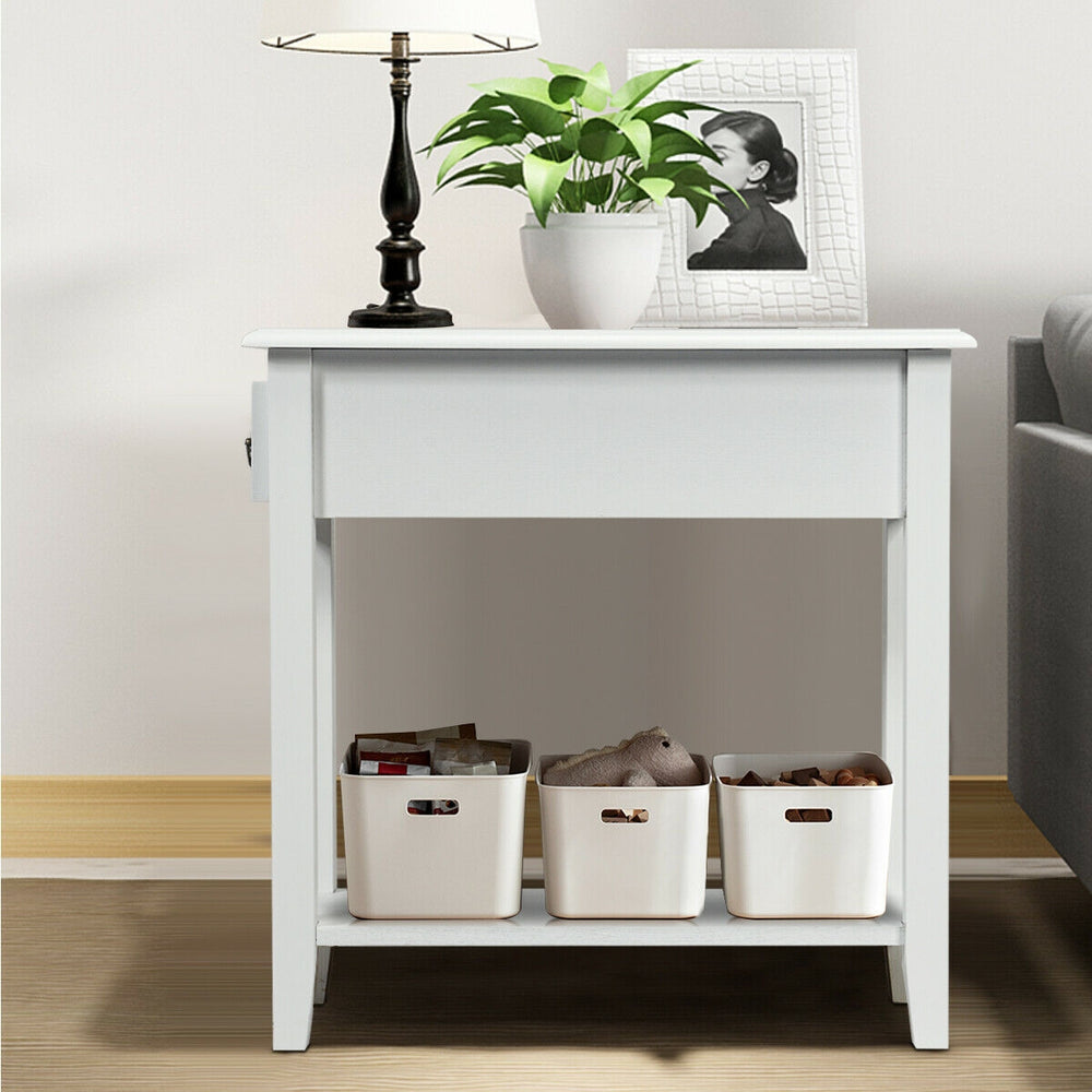 Narrow white 2-tier bedside table with drawer and lower shelf, made of P2 MDF and rubber wood, ideal for small spaces.