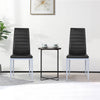 Two elegant black PVC leather dining side chairs with painted steel legs, perfect for modern dining spaces.