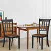 Two solid black spindle back dining chairs made of rubber wood, perfect for dining rooms and kitchens.