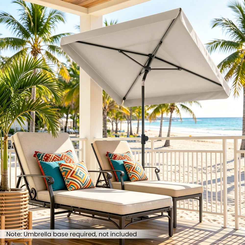 Rectangular beige outdoor umbrella with tilt adjust button, ideal for balconies and poolside relaxation.