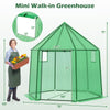 Mini walk-in greenhouse with PE cover, 6.5 x 5.6 x 6.2 FT, featuring a roll-up zippered door for easy access and.