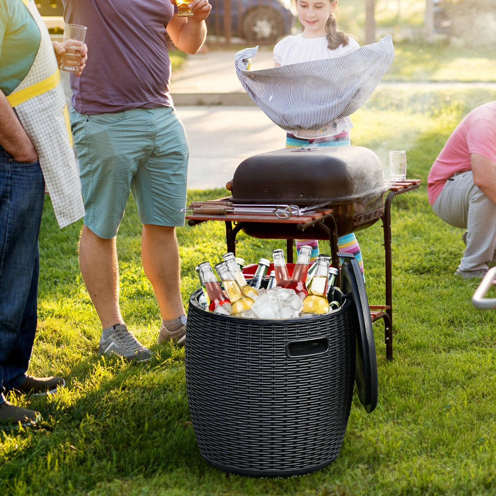 Black 9.5-gallon rattan cool bar cocktail table, serving as an ice bucket and side table for outdoor gatherings.