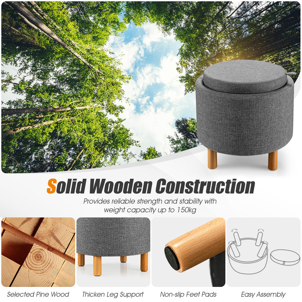 Round gray fabric storage ottoman with removable lid, solid pine wood legs, and non-slip pads for versatile use.