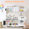 Wooden kids kitchen playset with washing machine, oven, and storage space, designed for imaginative play and creativity.